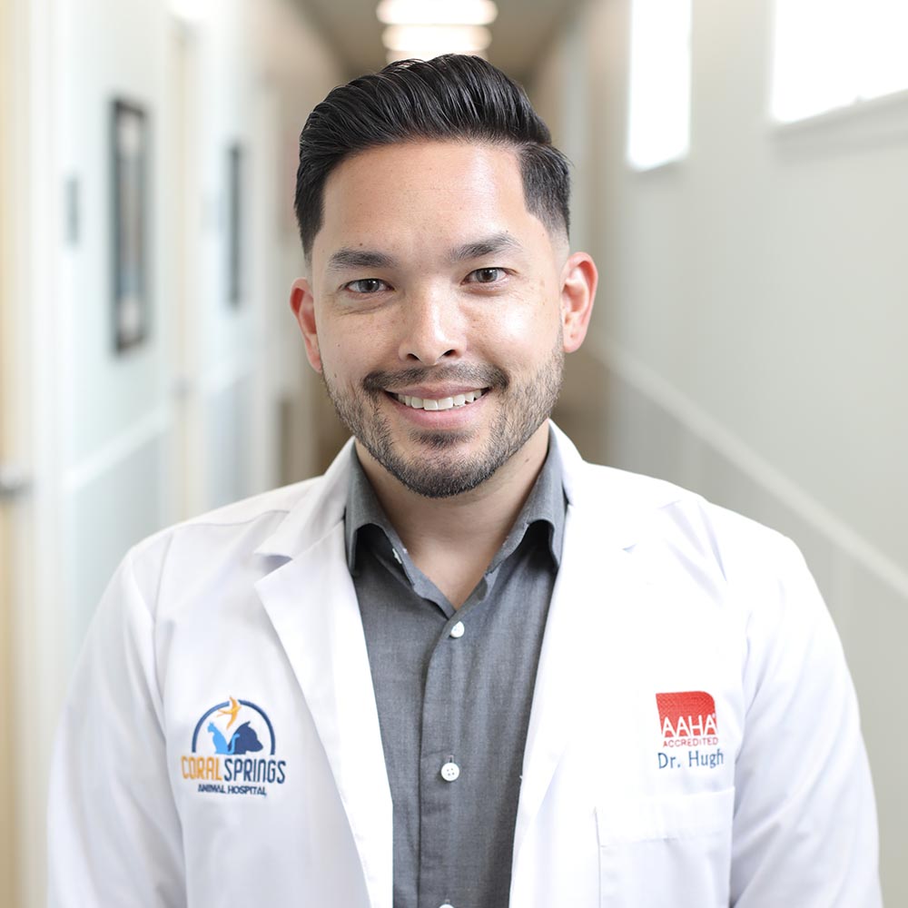 Dr. Ryan Hugh posing for a photo in the hallway