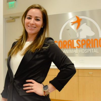 Vivi posing for a photo in front of the receptionist desk