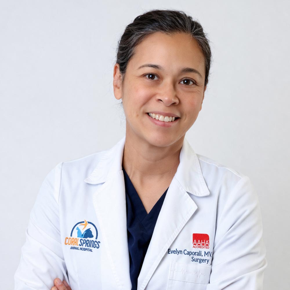 Dr Evelyn Caporali posing for a photo against a white wall