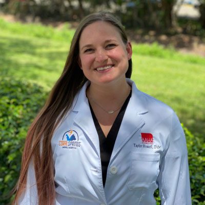 Dr. Taylor Howell posing for a photo outside