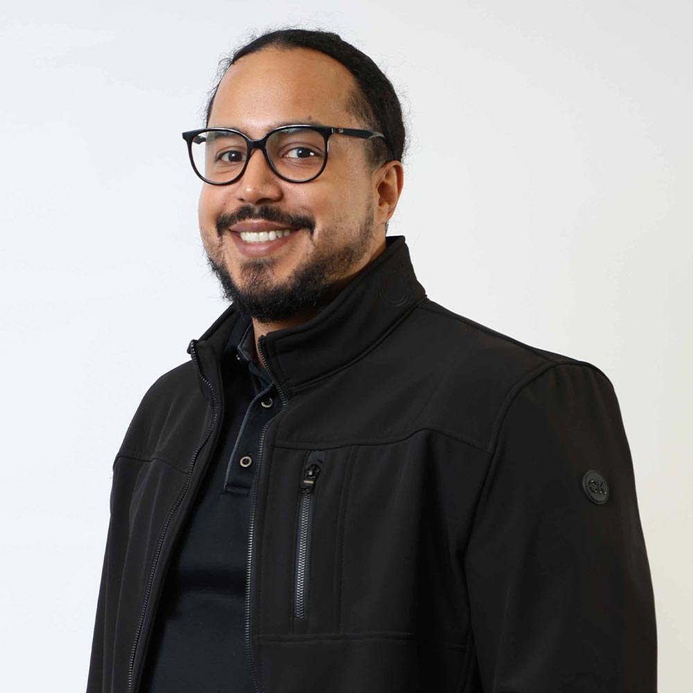 Felix Boudier posing for a photo against a white wall