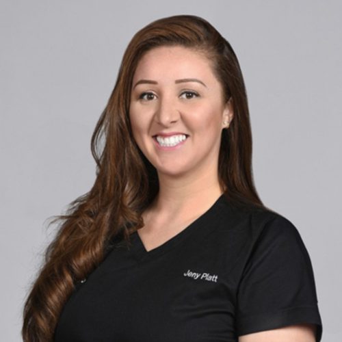 Jeny Platt wearing black scrubs and smiling at the camera