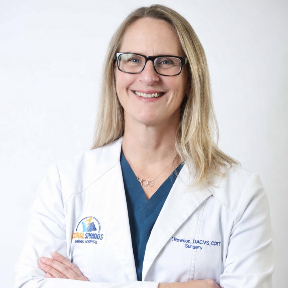 Dr Elizabeth Rawson posing for a photo against a white wall