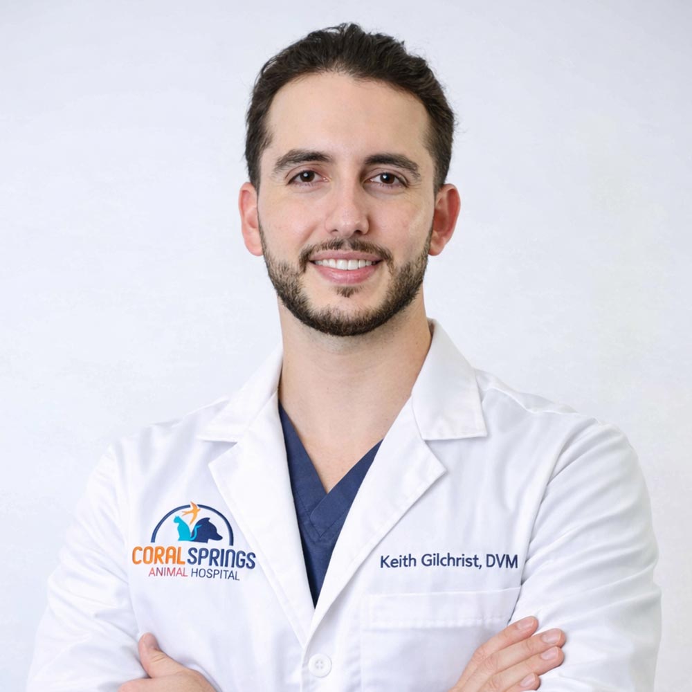 Dr Keith Gilchrist posing for a photo against a white wall